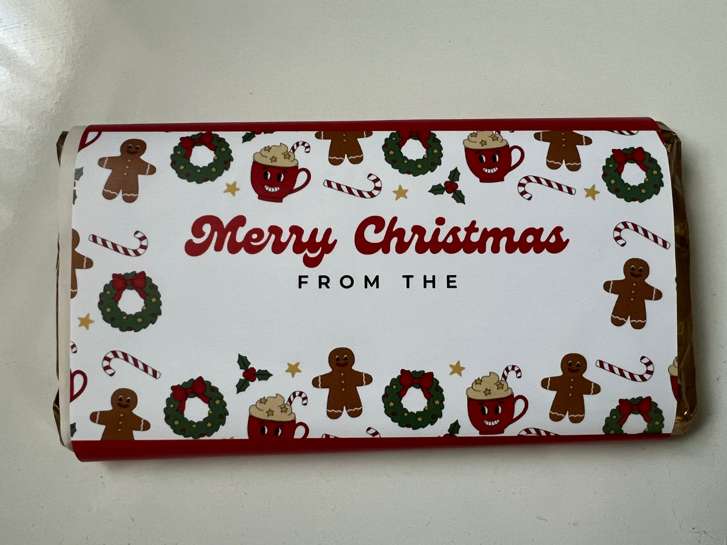 “Merry Christmas from the” chocolate bar wrapper